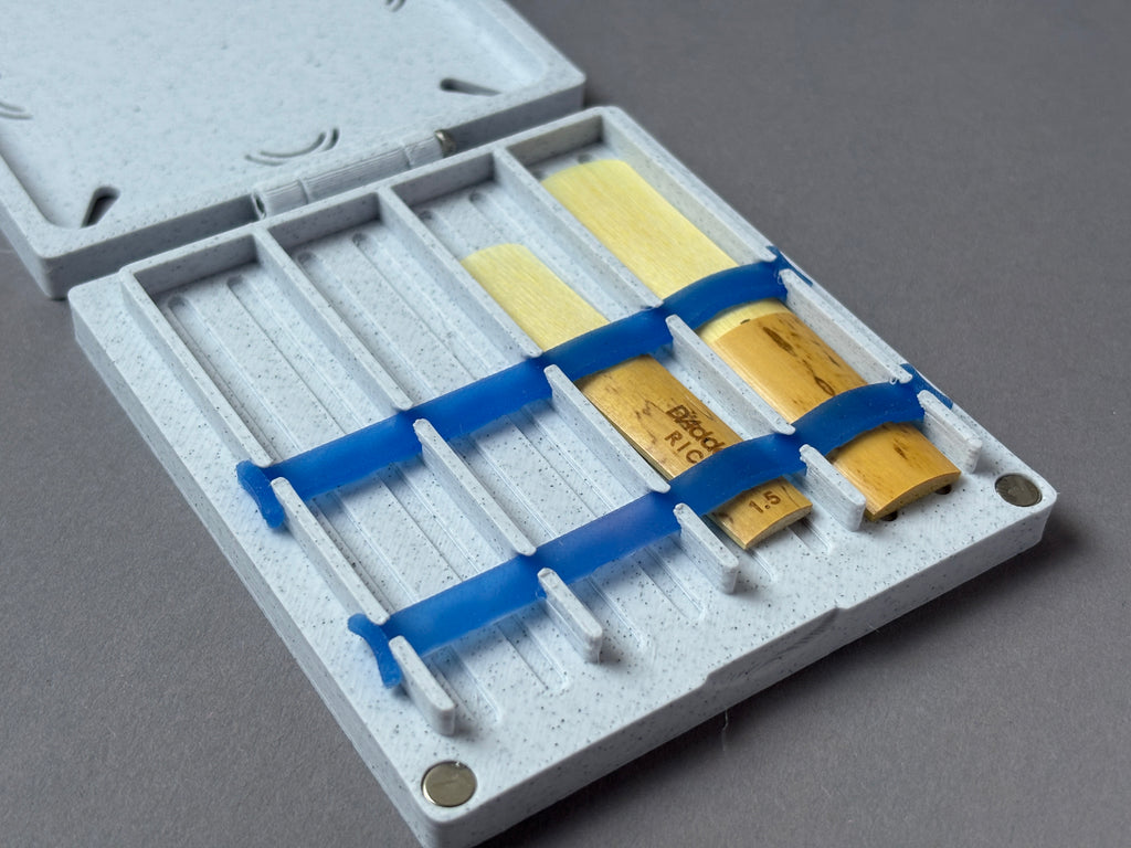 case with reeds for saxophone or clarinet removable blue silicon band strap