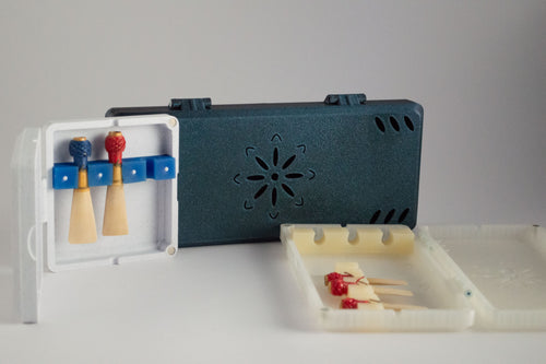 Handmade FswStudio contrabassoon reed cases in teal, marble and cream, open ones showing contrabassoon reeds in silicone straps